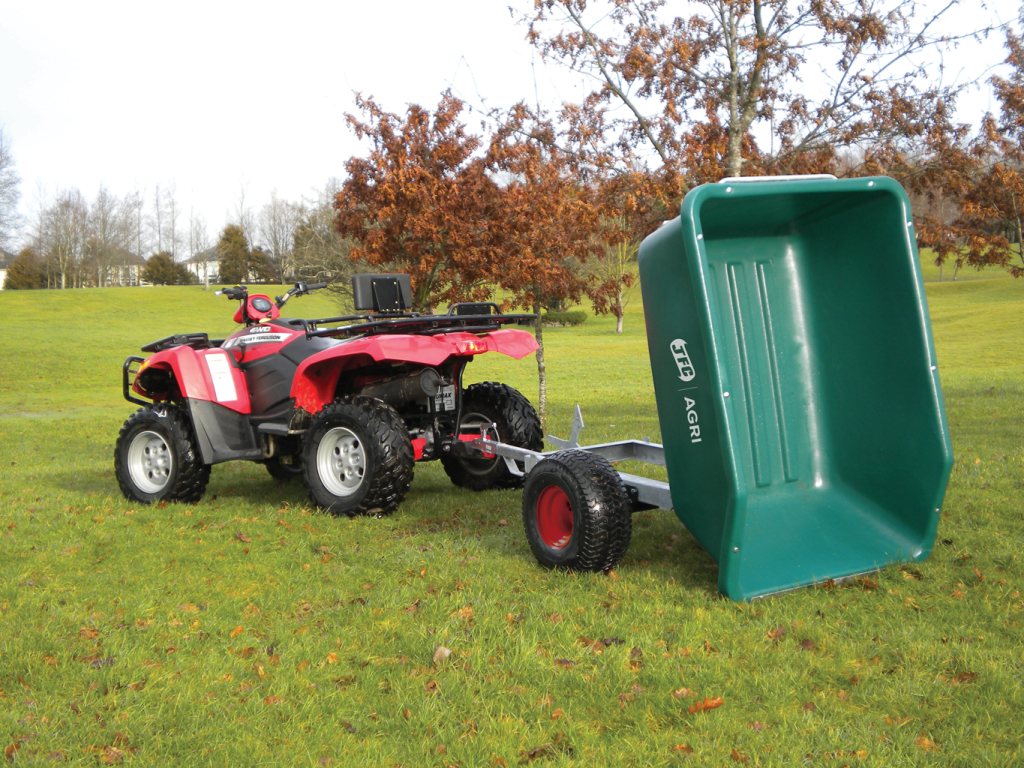 500 Litre ATV Tipping Trailer (Green) attached to a quadbike tipping backwards