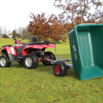 500 Litre ATV Tipping Trailer (Green) attached to a quadbike tipping backwards