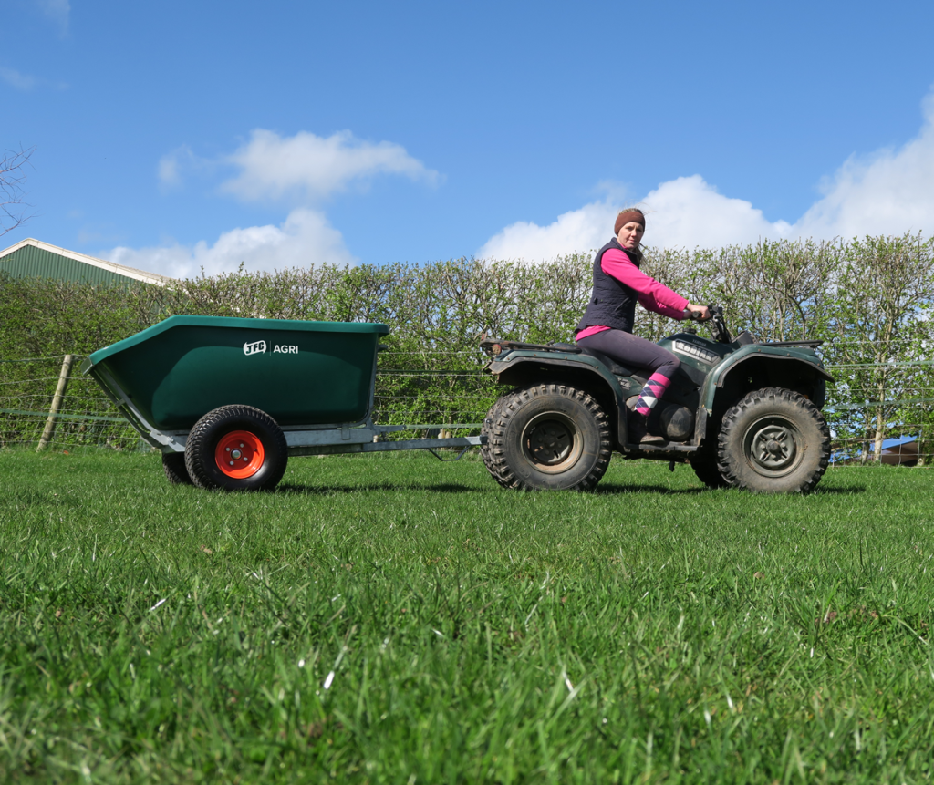 500 Litre ATV Tipping Trailer (Green) attached to a quadbike