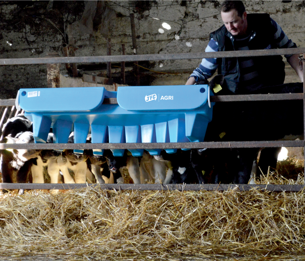 10 Teat Compartment Feeder - EazyFlow Teats hanging off fence