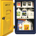 A small navy & yellow chemical storage cabinet by JFC open showing shelves full of chemicals