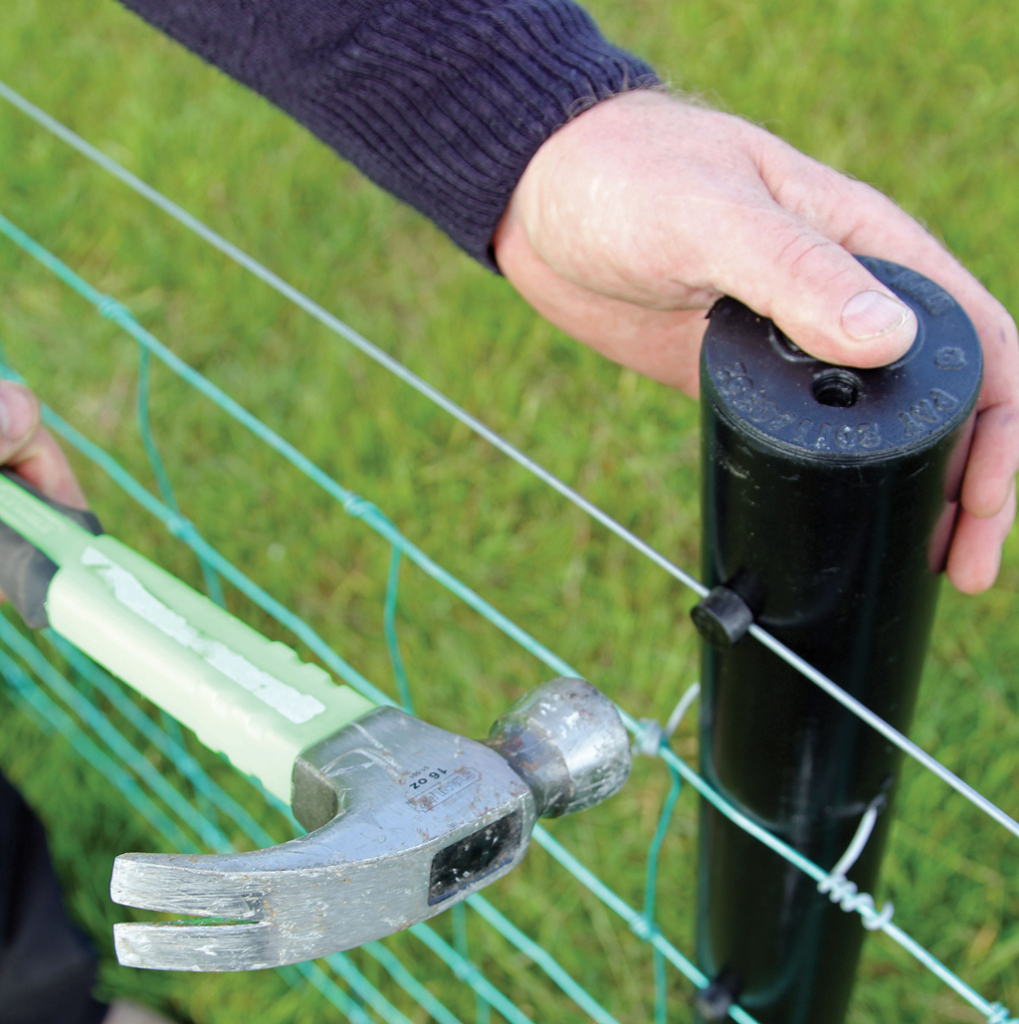 2g polyethylene hollow fencing post with farmer showing how to install wire